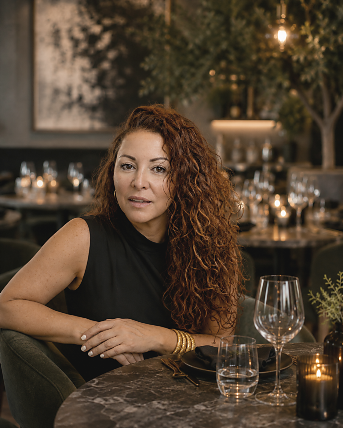 Susana Rodríguez, Brand Development & Marketing Lead at Caviar Consulting, in a restaurant setting
